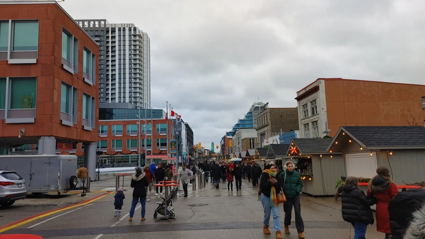 Crowd at an outdoor holiday market on a downtown Kitchener street